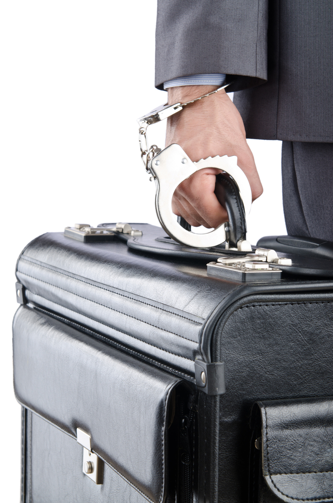Man,With,Briefcase,And,Handcuffs